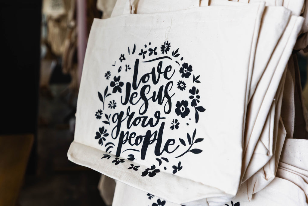 Love Jesus, Grow People Tote Bag